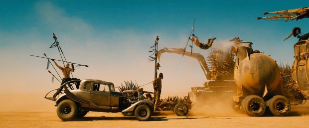 A stuntman leaps from vehicle to vehicle in 'Mad Max: Fury Road.'